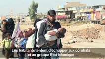 Des Irakiens fuient le front est de Mossoul