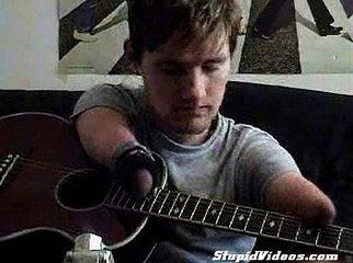 Armless man plays guitar and other