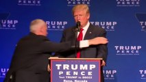Man led away by officers after Trump rushed offstage at Reno rally
