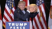 Trump shows off mask of his own face at Florida rally