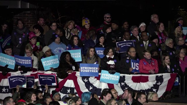 Clintons, Obamas unite for huge election-eve rally