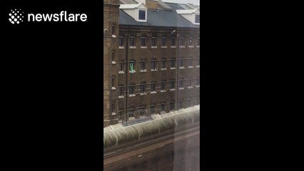 Inmates caught on camera 'passing contraband' between cells at UK prison