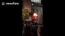 Protesters burn Donald Trump effigy