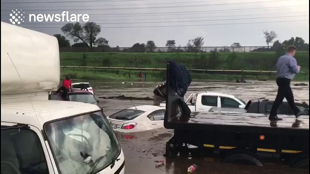 Dozens of cars submerged as highway in South Africa floods