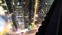 Man climbing giant building with no safety gear 1