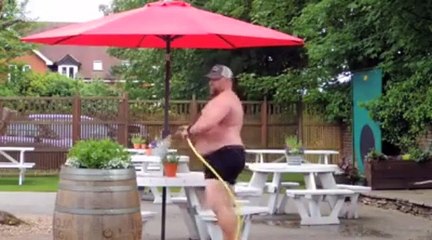 A man watering the plants in costume. This is what happens