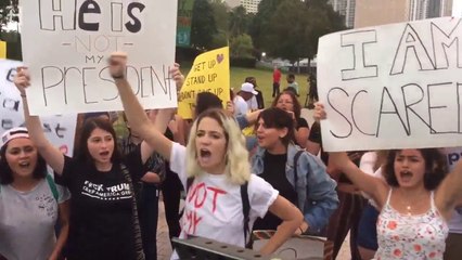 Uncivilized female Anti-Trumps block streets, chant "Not my president" ♿ Miami Herald