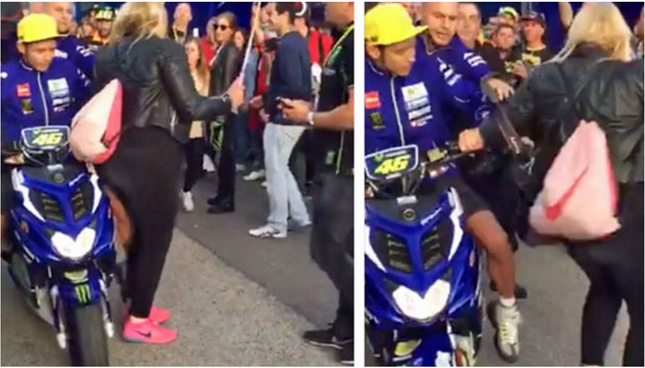 Rossi da un empujón y un codazo a una fan en Valencia