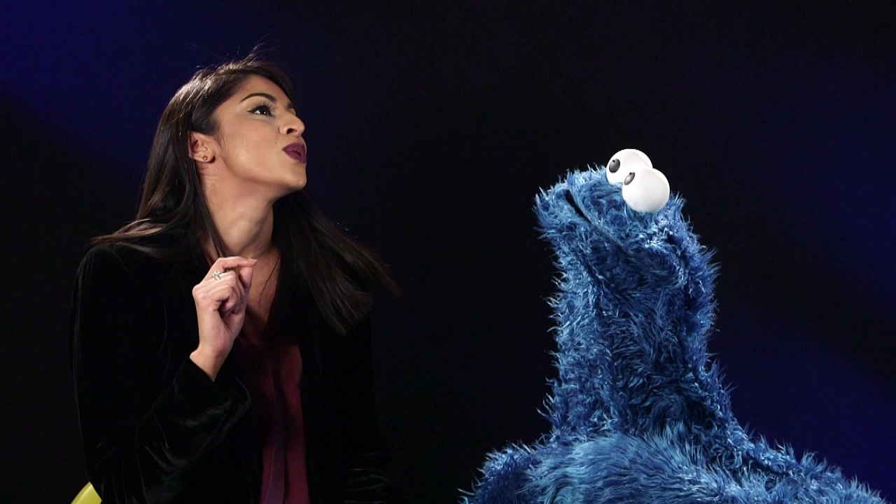Cookie Monster does his best British accent