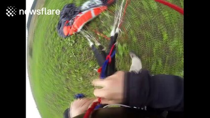 Daredevil base jumps off 200 ft wind turbine