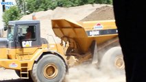 Dump truck driving and dumping load