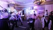 Wedding guests do mannequin challenge during first dance