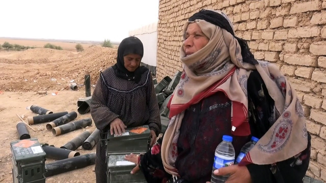In Raqa countryside, civilians gather empty ammunition boxes