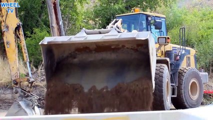 Komatsu WA 400 Loadear and Excavator working a road construction site