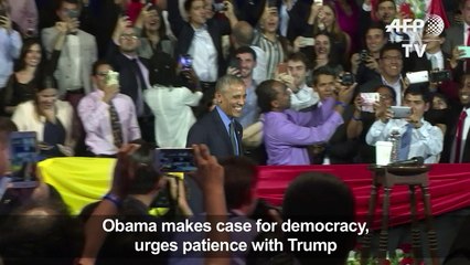 Obama makes case for democracy, urges patience with Trump