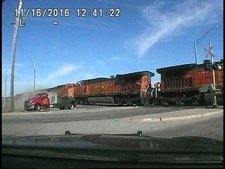 Train Crashes Into Two Truck