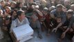 Iraqi forces hand out aid to desperate Mosul residents