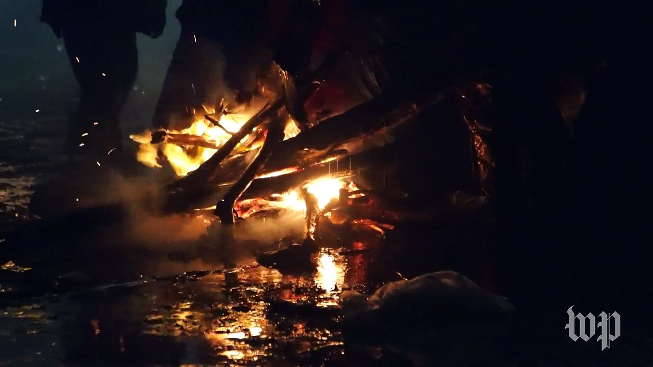 Police fire water cannon on protesters during freezing temperatures