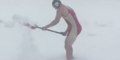Young Man in Wrestling Singlet Shovels Snow at Breakneck Speed