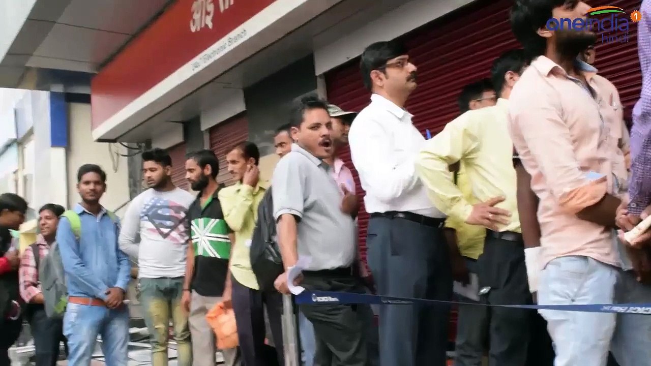 women remove her clothes in front of bank