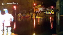 Firefighters rescue people from flood brought by Storm Angus in Manchester