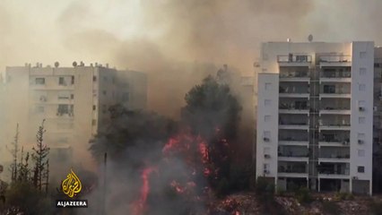 Israel: Thousands ordered to leave after massive fires hit Haifa