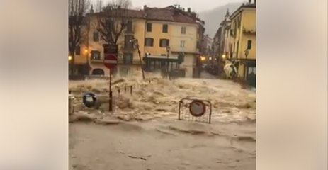 River Swells Dangerously Over Bridge in North Italian Town of Garessio