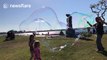 San Diego street performer blows GIANT bubbles