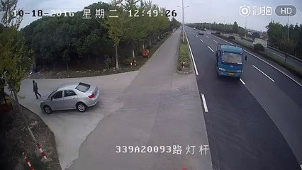 Car runs into overhanging truck