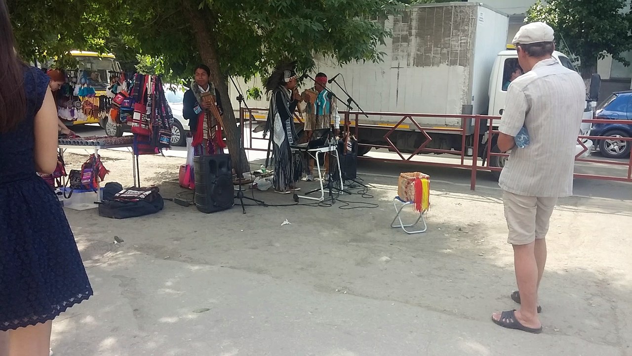 Strolling musicians from Cuba play on the sidewalk in Russia
