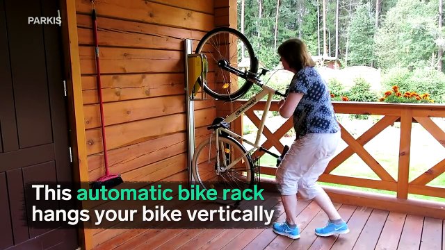 This automatic bike rack hangs your bike vertically.