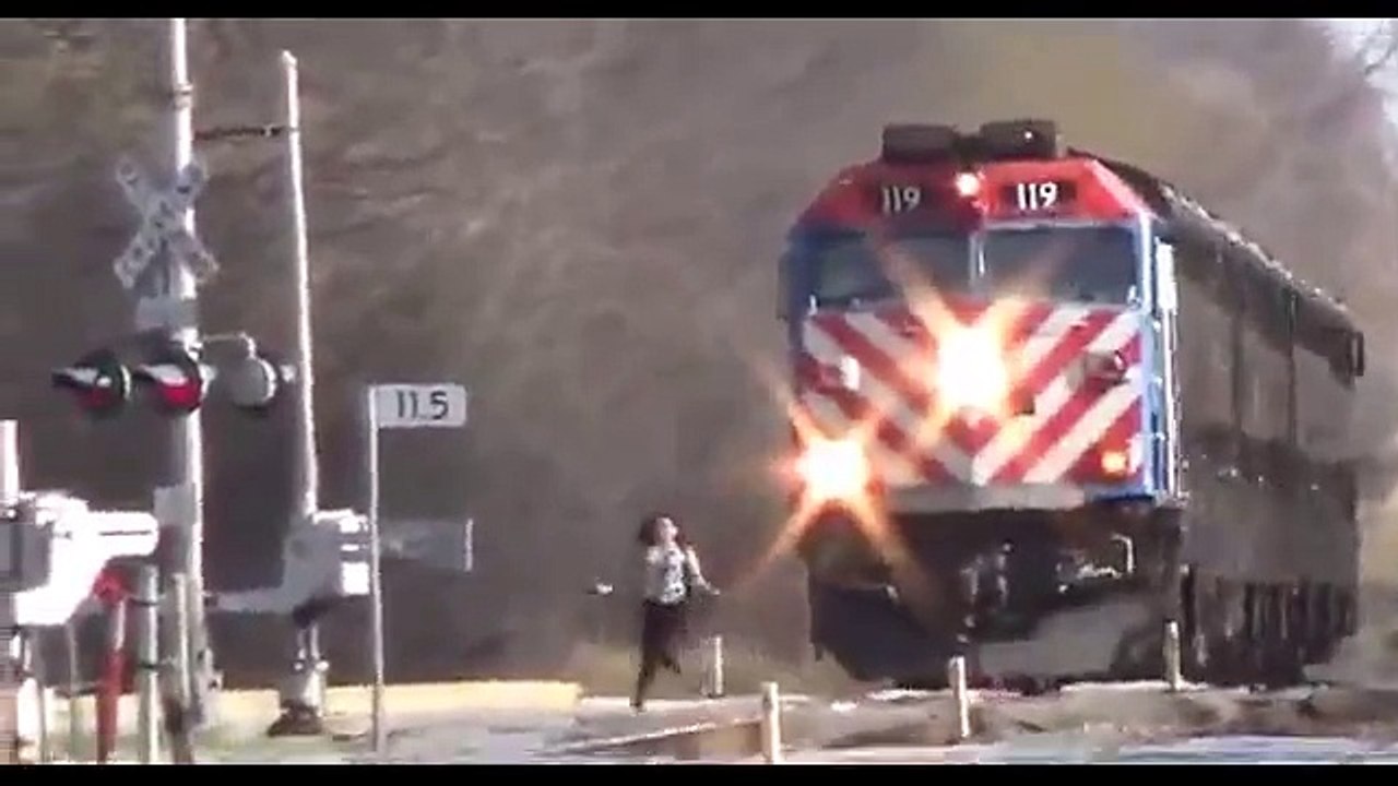 Jaw dropping moment girl runs in front of express train