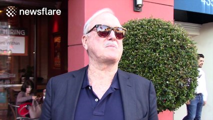 John Cleese tells the paparazzi what he thinks of Donald Trump