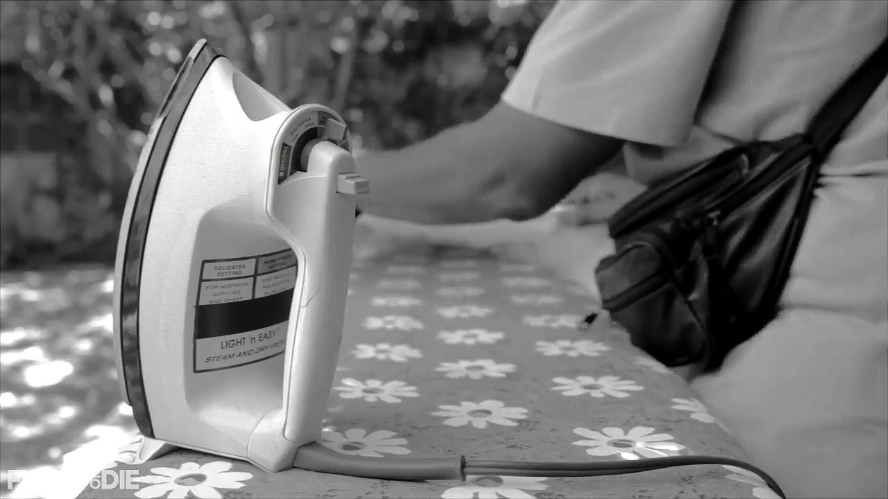 A MAN IRONING