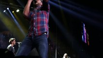 Watch Luke Bryan hit a guy in the front row for flipping him off | Rare Country