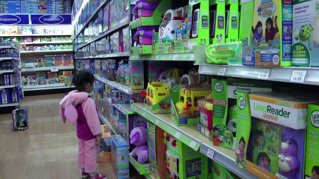 Girl Looking At Toys