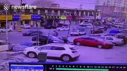 Bizarre accident leaves one car balancing on top of two cars