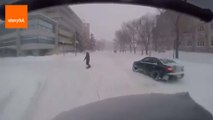 Snowboarder Towed Through Canadian Street