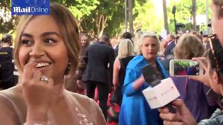Jessica Mauboy reacts to protest on the AACTA awards red carpet