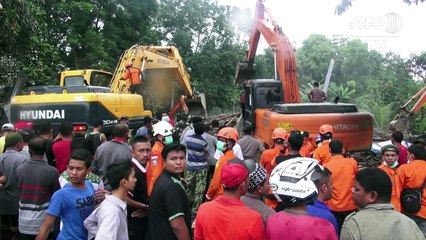 Séisme en l'Indonésie: recherches dans les décombres