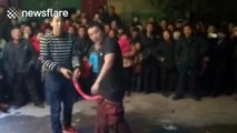 Chinese man puts one-metre-long firecracker between his legs and lights it