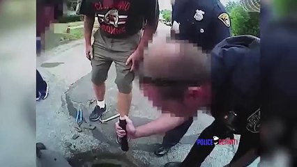 Bodycam Shows Cops Rescuing Dog from Sewer Drain