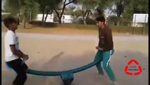 Pashto Funny Videos Funny Pathans in the Park on seesaw