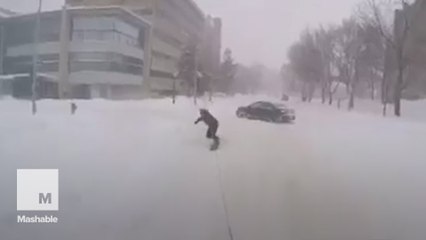 This Jeep towing snowboarders through city streets is so Canada
