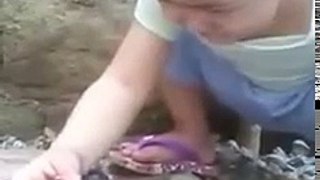 Emotional baby! A Baby crying when her chick is dead