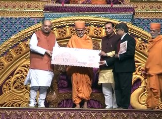 Surat Palanpur Pramukh Swami’s 96th birth anniversary marked with launch of postal stamps; Amit Shah and Vijay Rupani
