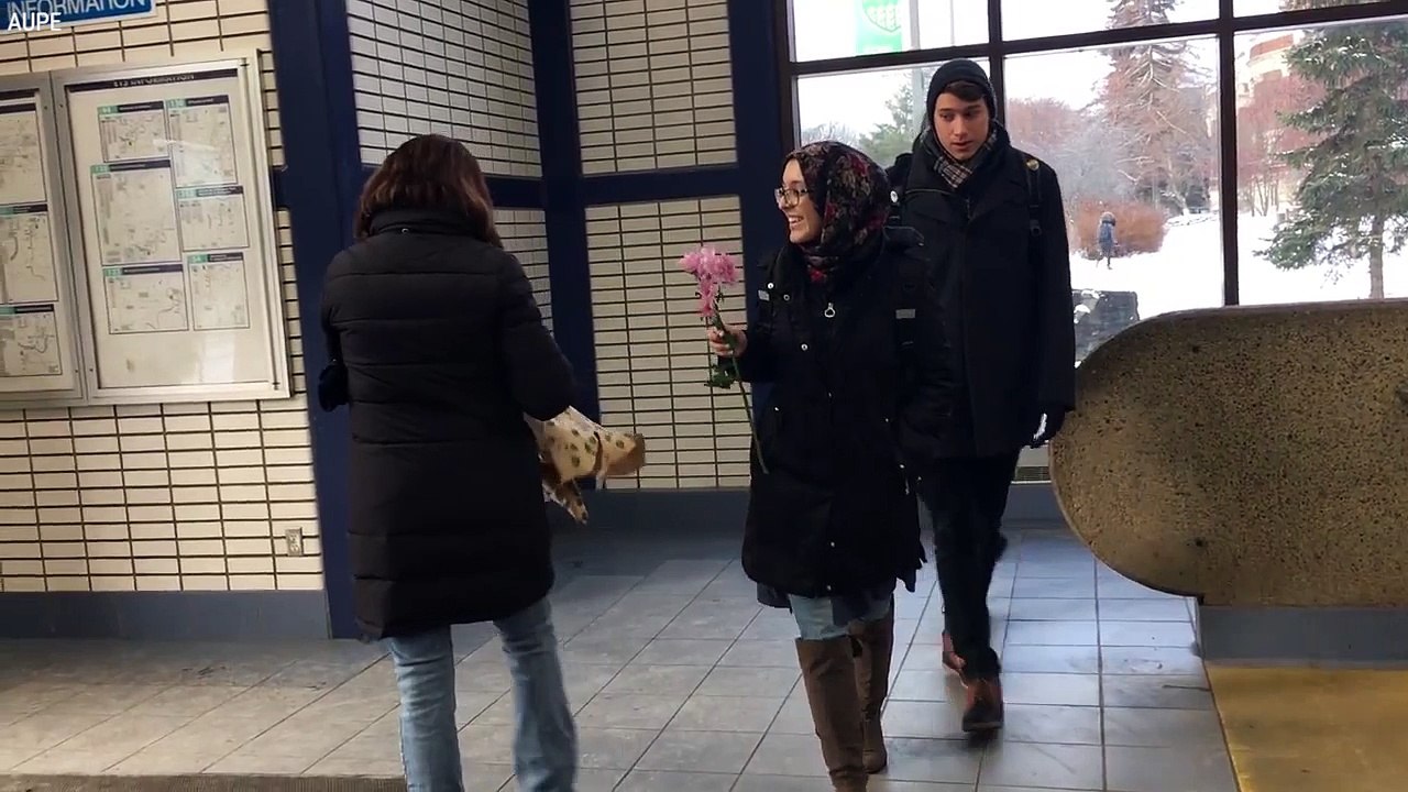 Volunteers Hand Out Flowers To Hijabi Women In Response To Hate Crime
