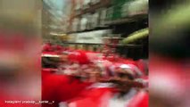 Merry Santa Con revellers dance and sing through streets