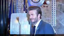 David Beckham lights the Empire State Building's tower lights blue to celebrate UNICEF's anniversary