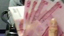 Un voleur de billet de banque bluffe un policier chinois